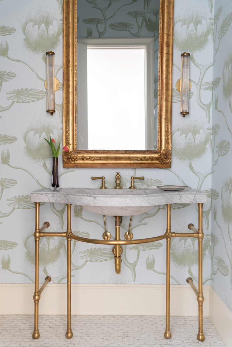 Bathroom photo with gilded mirror